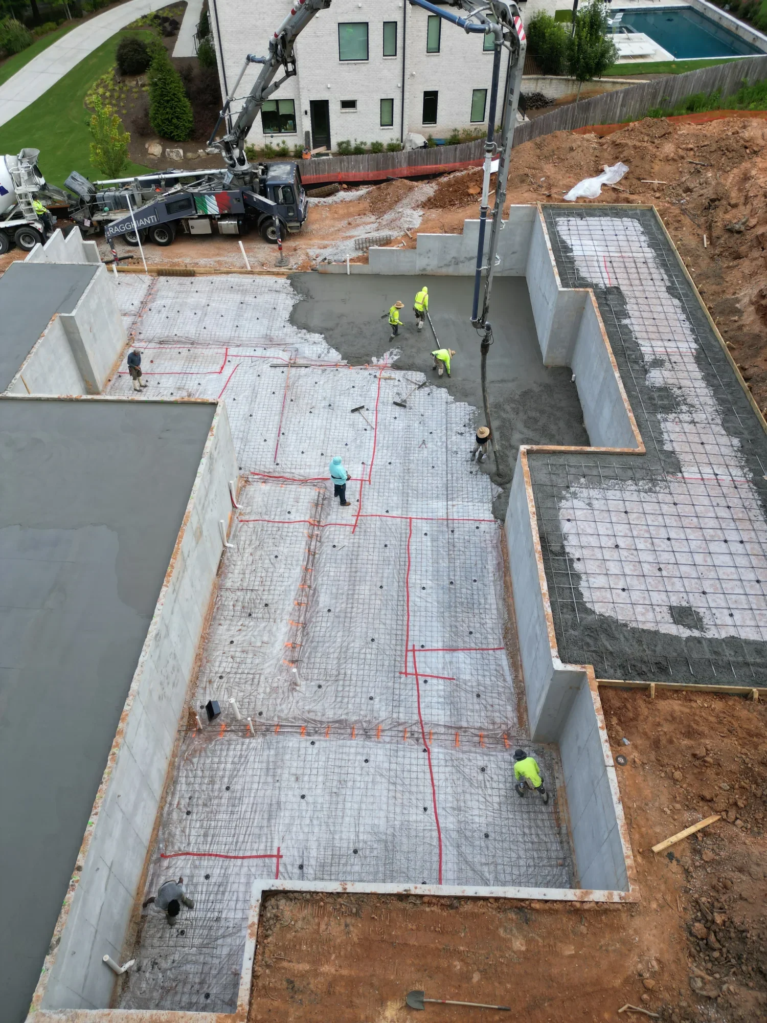 Framing materials staged at custom home site